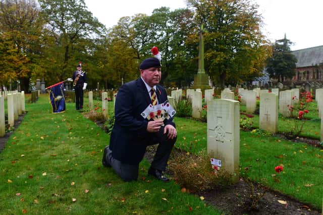 Gulf War veteran Alex Hendry laying crosses on war graves at Bishopwearmouth Cemetery ahead of Remembrance Day