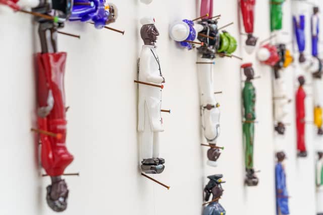 Colonial Ghost by artist Pascale Marthine Tayou consists of 32 Christian crosses, each made using five human figures, and it is on display at the National Glass Centre in Sunderland  Picture: DAVID WOOD