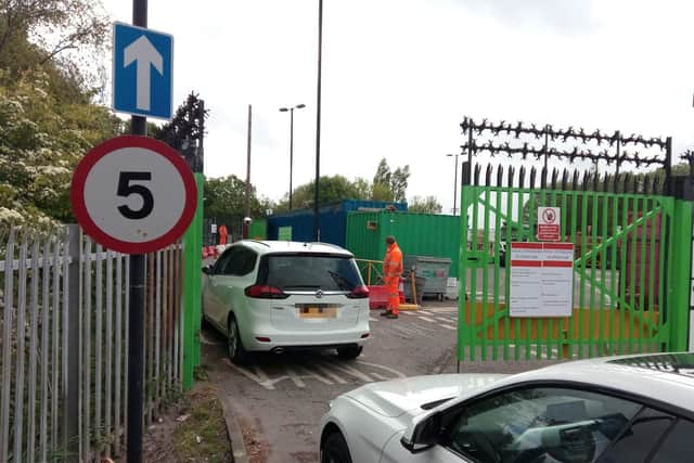 Cars wait to get access to the Household Waste and Recycling Centre in Beach Street.