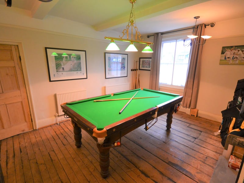 A second, front-facing lounge currently used as a games room.