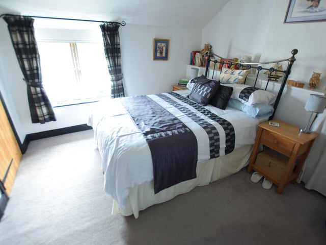 One of the five first-floor bedrooms.