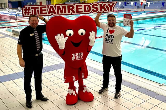 The co-founder of Red Sky Foundation, Sergio Petrucci (right), joined by the charity's as-yet-unnamed mascot.
