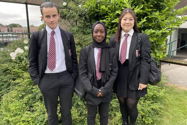 Thornhill Academy pupils Aliya Ospanova, Mubarakah Yusuf and Lewis Robinson wearing the new ties made from recycled plastic bottles.