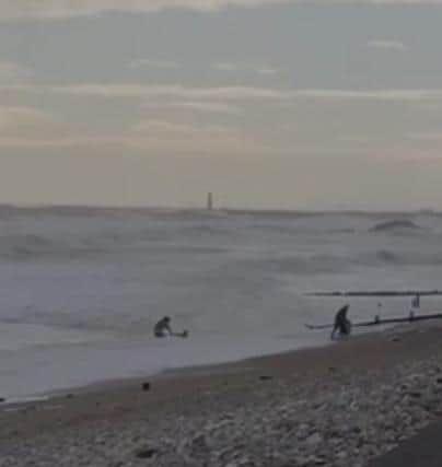 A passerby ran into the sea to help the 27-year-old