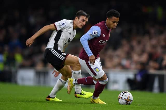 LONDON, ENGLAND - OCTOBER 20: Cameron Archer of Aston Villa runs ahead of Joao Palhinha of Fulham during the Premier League match between Fulham FC and Aston Villa at Craven Cottage on October 20, 2022 in London, England. (Photo by Justin Setterfield/Getty Images)