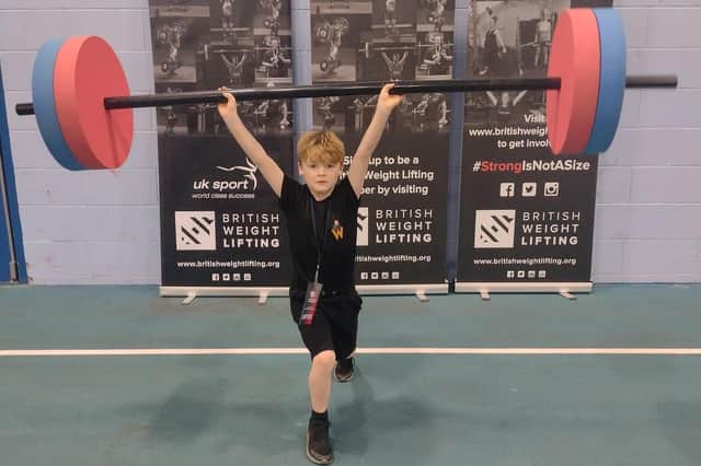 Young weightlifter Carter Mason in action.
