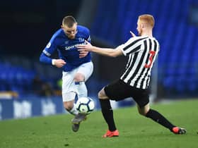LIVERPOOL, ENGLAND - MAY 08:  Josh Bowler of Everton and Liam Gibson of Newcastle United in action during the Premier League Cup Final match between Everton and Newcastle United at Goodison Park on May 08, 2019 in Liverpool, England. (Photo by Nathan Stirk/Getty Images)