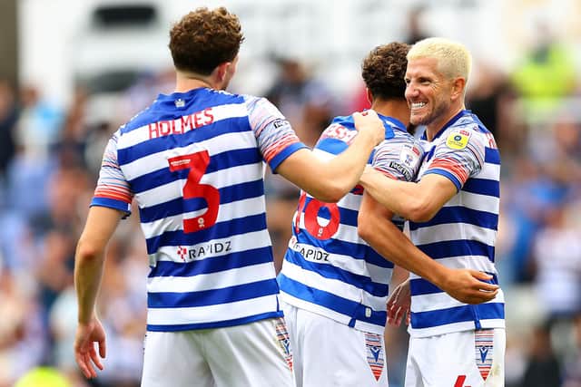 READING, ENGLAND - SEPTEMBER 04: Tom Holmes, Nesta Guinness-Walker and Sam Hutchinson of Reading celebrate their victory after the Sky Bet Championship match between Reading and Stoke City at Select Car Leasing Stadium on September 04, 2022 in Reading, England. (Photo by Clive Rose/Getty Images)
