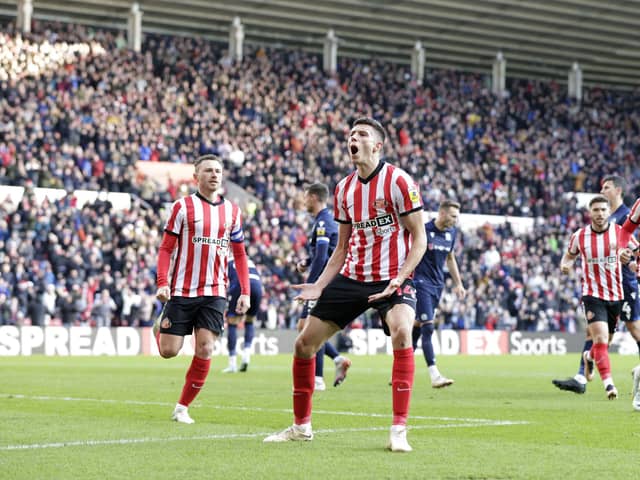 Sunderland's Ross Stewart (centre) celebrates scoring from the penalty spot to make the score 1-1 during the Sky Bet Championship match at the Stadium of Light, Sunderland. Picture date: Monday December 26, 2022.