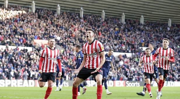 Sunderland's Ross Stewart (centre) celebrates scoring from the penalty spot to make the score 1-1 during the Sky Bet Championship match at the Stadium of Light, Sunderland. Picture date: Monday December 26, 2022.