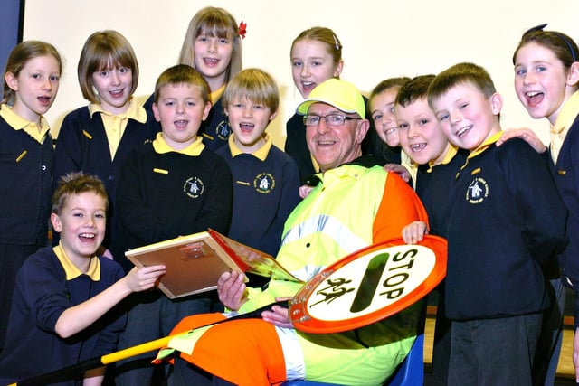 The Sunderland School Crossing Patrol of the Year 2010 went to John Plumb at Fulwell Junior School, and here he is pictured with members of the school council.