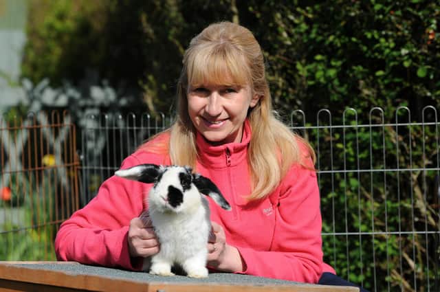 Linda Anderson is just one of Pawz for Thought's animal foster carers. Linda poses with Joe.