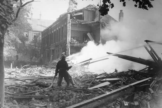 Tackling a fire after an air raid in St George's Square in 1943.