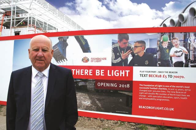 Sir Bob Murray at the Foundation of Light's Beacon of Light building prior to its 2018 opening.