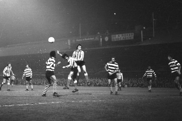Dave Watson and Billy Hughes in the thick of the action against Sporting Lisbon.