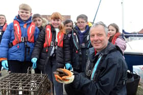 Wildlife Biologist Stephen Brend alongside pupils from Seaburn Dene Primary School who are looking to restore oyster populations to the North Sea.