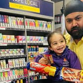 Hamreek Singh and his niece, of Empire Stores in Grindon, showing off some of the goodies in the penny bundle.