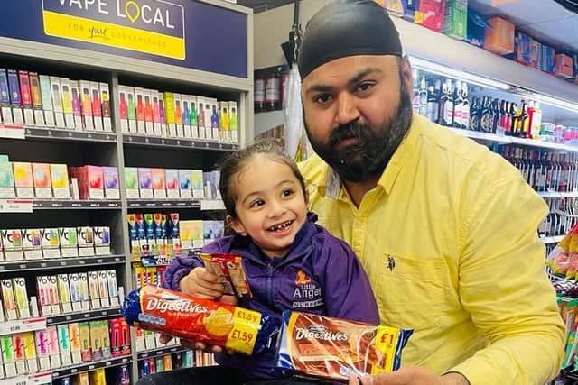 Hamreek Singh and his niece, of Empire Stores in Grindon, showing off some of the goodies in the penny bundle.