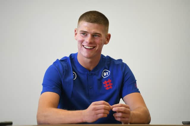 BURTON-UPON-TRENT, ENGLAND - MAY 31: Charlie Cresswell of England U21s is interviewed during the England U21 Men Media Activity at St Georges Park on May 31, 2022 in Burton-upon-Trent, England. (Photo by Nathan Stirk/Getty Images)