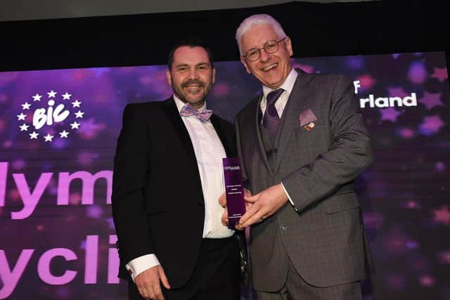 Andy collects his Sole Trader of the Year trophy at last year's awards from Paul McEldon from the North East BIC.
