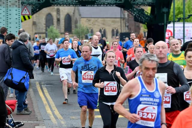 Runners head over the Wearmouth Bridge following a previous Sunderland City Runs festival