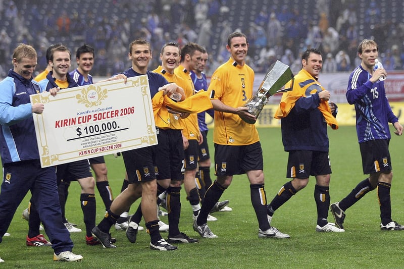 David Weir of Scotland holds a winning trophy with team after playing in the Kirin Cup Soccer 2006 between Scotland and Japan at the Saitama stadium on May 13, 2006 in Saitama, Japan. (Photo by Koichi Kamoshida/Getty Images)