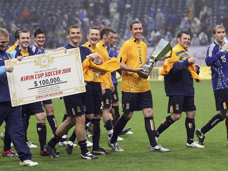David Weir of Scotland holds a winning trophy with team after playing in the Kirin Cup Soccer 2006 between Scotland and Japan at the Saitama stadium on May 13, 2006 in Saitama, Japan. (Photo by Koichi Kamoshida/Getty Images)