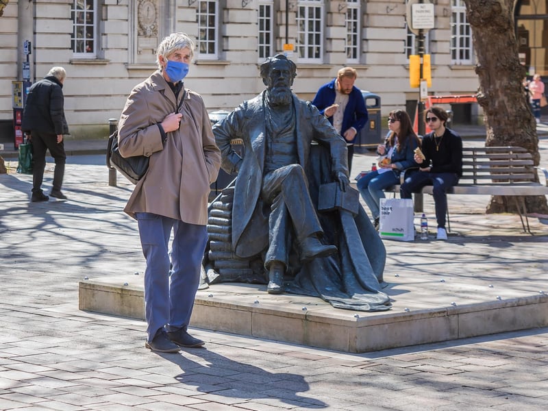 Portsmouth resident observes a minutes silence for Prince Philip. Picture by Mike Cooter.
