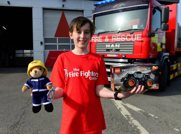 William Young has been congratulated for his fundraising for the Fire Fighters' Charity. Picture by Frank Reid