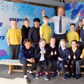 Fulwell Junior School children and headteacher Peter Speck celebrate their outstanding Ofsted report.