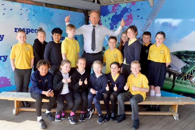 Fulwell Junior School children and headteacher Peter Speck celebrate their outstanding Ofsted report.