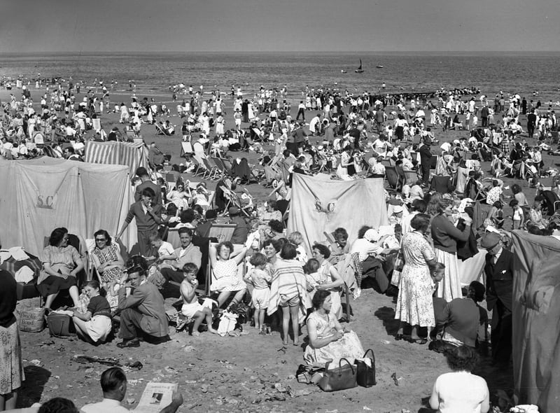 Seaburn Beach on a busy day in August 1956 showing the moveable landing and boat that offered boat tours around Whitburn Bay.