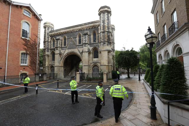 Police at the Abbey gateway of Forbury Gardens in Reading town centre following a multiple stabbing attack in the gardens which took place at around 7pm on Saturday leaving three people dead and another three seriously injured. Picture by Jonathan Brady/PA Wire