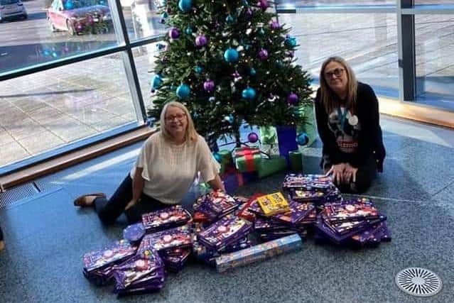 Workers at Arriva with their donations last year