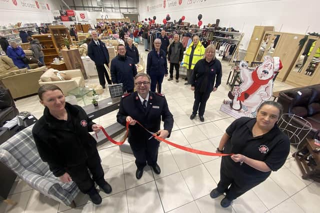 From left, store manager Leanne Cavanagh, Maj David Burns and assistant manager Susanne Hart cut the ribbon to officially open the Salvation Army donation centre Hylton Park.