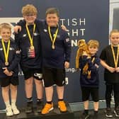 From left: weight lifters Matthew Lawrance, Jacob McDonald, James Newton, Carter Mason (and friend) and Archie Fowler of Weights & Cakes after their recent success at the British Age Group Championships in Leeds.