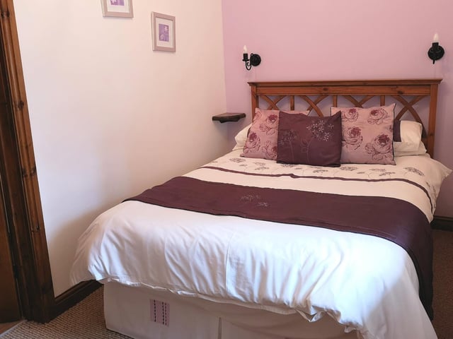A bedroom inside the cottage.