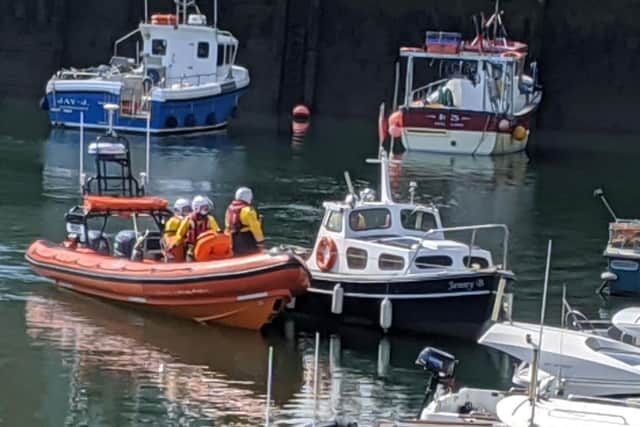 A photo shared by Sunderland RNLI as its volunteers helped the boat back into the marina at Roker.