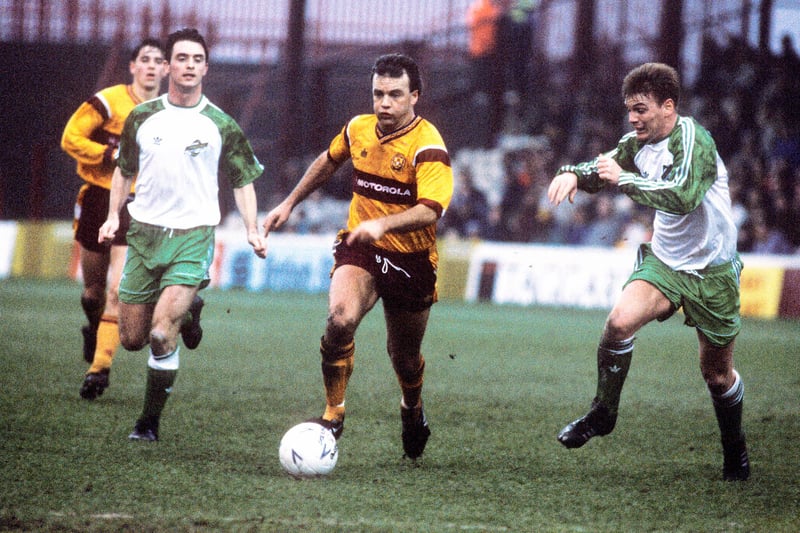 Motherwell's Davie Cooper (2nd right) advances flanked by Hibs pair Gordon Hunter (right) and Brian Hamilton durng a 1-1 draw at Fir Park in February 1992
