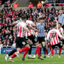 Sheffield Wednesday's Harlee Dean heads at goal during the Sky Bet League One play-off semi-final, first leg match at the Stadium of Light, Sunderland. Picture date: Friday May 6, 2022.