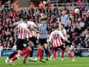 Sheffield Wednesday's Harlee Dean heads at goal during the Sky Bet League One play-off semi-final, first leg match at the Stadium of Light, Sunderland. Picture date: Friday May 6, 2022.