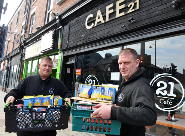 Cafe 21 owners Stan Johnson (left) and Dave Potter who are offering free food to those in need.