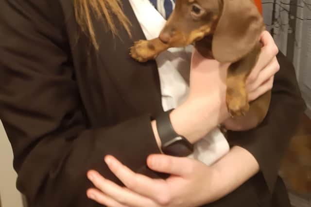 Kayleigh with her beloved pet, a miniature dachshund called Oscar.