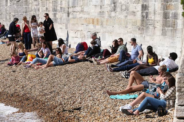 Sunbathers at the Hot Walls, Old Portsmouth - one of Portsmouth's most popular spots on a sunny day - on April 17. 
Picture: Chris Moorhouse      (170421-49)