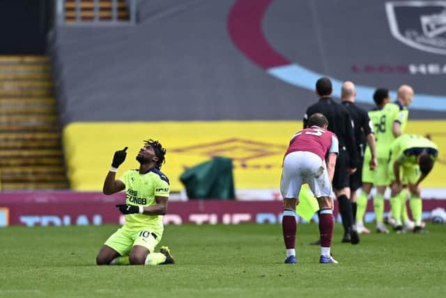 Newcastle United's French midfielder Allan Saint-Maximin  celebrates winning the  English Premier League football match between Burnley and Newcastle United at Turf Moor in Burnley, north west England on April 11, 2021.