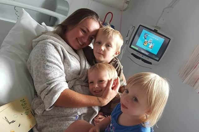 Stephanie with her children Joey, Jesse and Frankie when they were able to visit her in hospital.