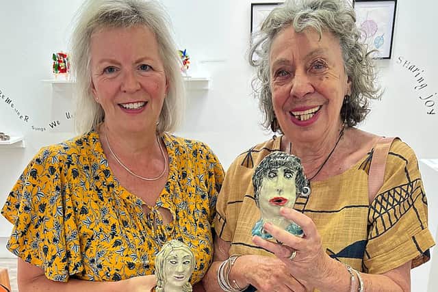Lyn Chapman, left, with Anne Walton and their ceramic, self-portrait heads which feature in the exhibition.