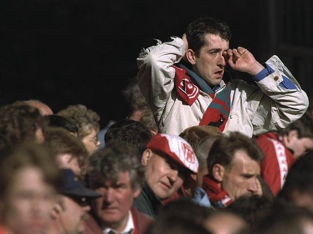 Disappointed Sunderland supporters look on as their team are relegated after the FA Carling Premier League match against Wimbledon at Selhurst Park on 11 May 1997.