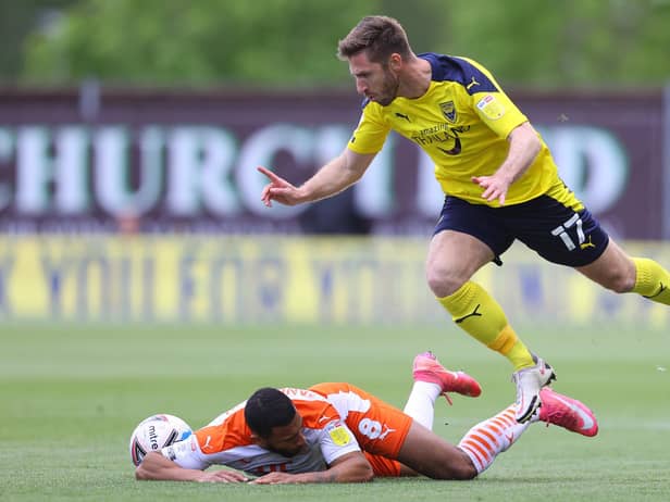 OXFORD, ENGLAND - MAY 18: Keshi Anderson of Blackpool is challenged by James Henry of Oxford United during the Sky Bet League One Play-off Semi Final 1st Leg match between Oxford United and Blackpool at Kassam Stadium on May 18, 2021 in Oxford, England. A limited number of fans will be allowed into the stadium as Coronavirus restrictions begin to ease in the UK following the COVID-19 pandemic. (Photo by Richard Heathcote/Getty Images)