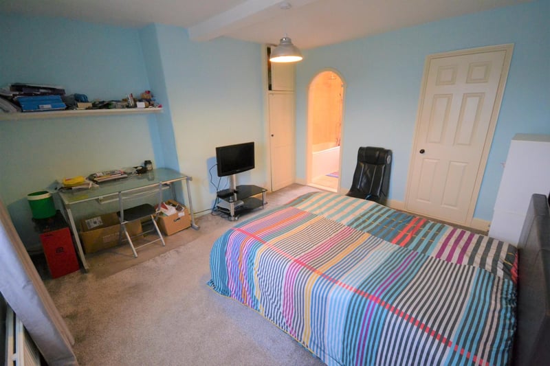Generous-sized, front-facing double bedroom with two useful storage cupboards and access to the ensuite.
